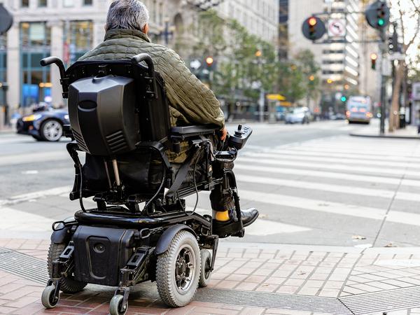 06-Pedestrian-in-electric-wheel-chair_1622087701.jpg